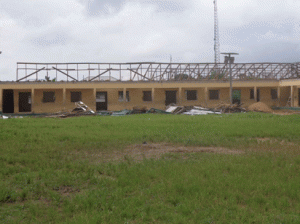 The President’s school being rebuilt. Inset: Dr. Walton Liverpool