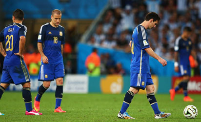 ionel Messi of Argentina (R) looks dejected after a goal during the 2014 FIFA World Cup Brazil Final match between Germany and Argentina at Maracana on July 13, 2014 in Rio de Janeiro, Brazil. (Photo by FIFA
