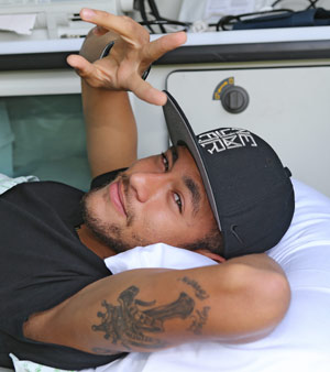Injured Brazil star Neymar departed his team's training base in Terespolis in a helicopter on Saturday and headed home to Sao Paulo, after his World Cup ended in agony on Friday night. AFP PHOTO