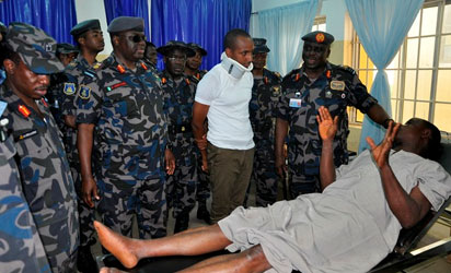 CAS, his entourage and one of the survivors (Flight Lieutenant NM Halilu) commiserating with Warrant Officer Augustine Nwanonen