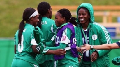 Courtney Dike (L) of Nigeria celebrates her team's first goal with team mates during the FIFA U-20 Women's World Cup Canada 2014 group C match between Korea Republic and Nigeria at Moncton Stadium on August 9, 2014 in Moncton, Canada. (Photo FIFA)