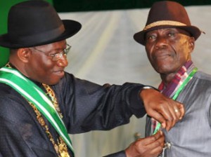President Goodluck Jonathan (L), presenting a 'Member of the Order of the Federal Republic (MFR)' Award To A Taxi Driver, Mr Imeh Usuah, who returned the sum of N18m (Eighteen Million Naira) forgotten in his car by a customer, in Abuja on Monday (29/9/14).