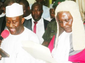 SWEARING-IN: Gov. Bala Ngilari of Adamawa (left), taking oath of office before Justice Lawan Lagre in Yola, yesterday. Photo: Nan.