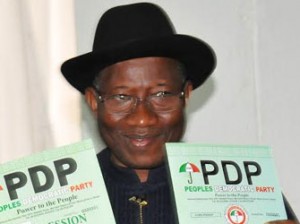 President Goodluck Jonathan displaying Expression of Interest and Nomination Forms at the People's Democratic Party's Secretariat in Abuja on Thursday (30/10/14).