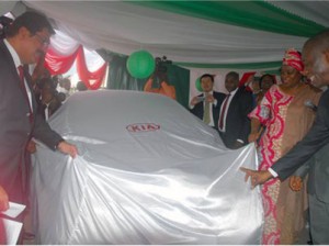 LEFT: The Chief Commercial Officer of Kia Motors Nigeria, Mr Sandeep Malhotra, (Right)The Managing Director of BKG Exhibitions, Mr Ifeanyi Agu, and The Minister of State, FCT, Mrs. Olajumoke Akinjide at the unveiling of the Made-in-Nigeria Kia cars, Eagle Square, Abuja