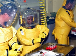 An image made available by the Center for Emerging and Zoonotic Diseases research laboratory at the National Institute for Communicable Diseases and taken on November 21, 2011, shows laboratory technicians and physicians working on samples during research on the evolving Ebola disease in bats, at the Center for Emerging and Zoonotic Diseases research Laboratory of the National Institute for Communicable Diseases in Pretoria. AFP PHOTO