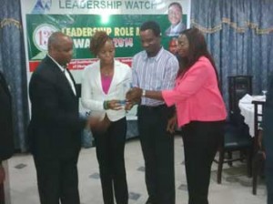 Mr. Simon Tachie, Director, Hospital Administration, First Consultant Medical Centre, and other staff of the hospital receiving the Leadership Watch, 13th Annual Leadership Role Model Awards 2014, on behalf of Dr. Ameyo Stella Adadevoh