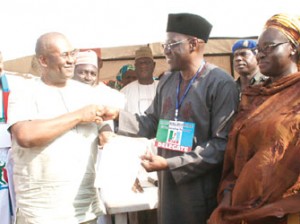 Governor Abdulfatah Ahmed of Kwara State (2nd right) receiving his certificate of return.