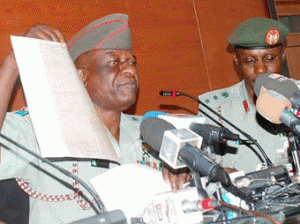 Director, Army Public Relations, Brig.-Gen. Olajide Laleye, displaying documents on
Retired Gen. Muhammadu Buhari Certificate, during a news conference on activities of
Nigerian Army In Abuja on Tuesday . With him is the Chief Of Staff, Directorate of
Army Public Relations, Nigerian Army Headquarters, Col. Timothy Antigha.