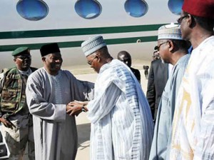 VISIT—President Goodluck Jonathan, being received by Governor Kashim Shettima of Borno State (3L)while others watch at the Maiduguri International Airport, yesterday, when the President visited Borno over the ongoing activities of Boko Haram. Inset: President Jonathan with some of the wounded soldiers during the visit. Photos: Ndahi Marama/State House.