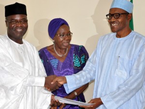 PDM adopt Buhari: National Chairman of Peoples Democratic Movement (PDM), Bashir Yusuf Ibrahim (left) presenting resolution of the National Executive Committee of the party to adopt Gen. Muhammadu Buhari of APC as their Presidential Candidate to Buhari, while Deputy National Chairman South West, Mrs Titilayo Ajanaku looks on in Abuja. Photo: Gbemiga Olamikan.