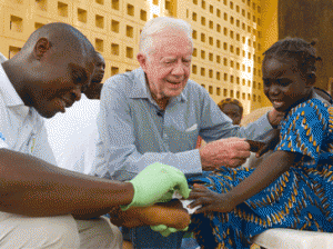 • Former U.S. President Jimmy Carter comfort ng 6-year-old Ruhama Issah at Savelugu (Ghana) Hospital as a Carter Centre technical assistant dresses Issah's extremely painful Guinea worm wound. In May 2010, Ghana reported its last case of Guinea worm disease and announced it had stopped disease transmission a year later.