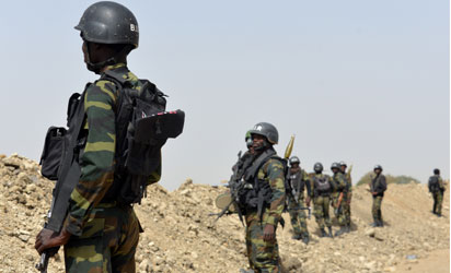 A picture taken on February 17, 2015 shows Cameroonian soldiers patrolling in the Cameroonian town of Fotokol, on the border with Nigeria, after clashes occurred on February 4 between Cameroonian troops and Nigeria-based Boko Haram insurgents. Nigerian Boko Haram fighters went on the rampage in the Cameroonian border town of Fotokol on February 4, massacring dozens of civilians and torching a mosque before being repelled by regional forces   AFP PHOTO