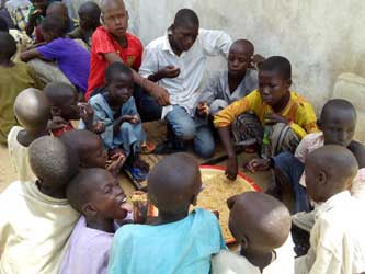 *Displaced children scrambling for food at an IDPs camp in Maiduguri... How safe are they?