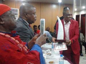 •Festus receiving tusks and certificate at the ceremony