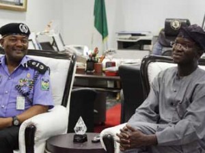 Lagos State Governor, Mr. Babatunde Fashola, SAN (right) discussing with the Assistant Inspector- General of Police, Zone II, Mr. Joseph Mbu (left) during his courtesy visit to the Governor at the Lagos House, Ikeja, on Tuesday, February 03, 2015.