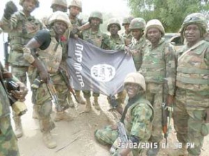 •Troops with a dismantled Boko Haram flag
