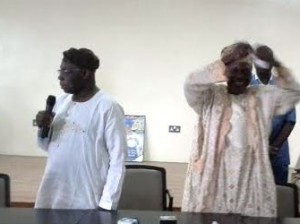 OBASANJO—Ex-President Obasanjo (left) watches as Alhaji Usman Oladunjoye tears the PDP membership card. Right: Obasanjo's card after it was torn, yesterday.