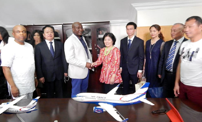 Chairman of Air Peace, Chief Allen Onyema in handshake with the President of   Overseas Investment Union of China (OIUC), Ms. Pansy Liu during the visit.