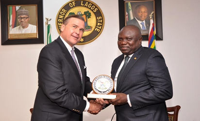  Lagos State Governor, Mr. Akinwunmi Ambode (right), presenting a State   plaque to the US Ambassador to Nigeria, Mr. Stuart Symington during a courtesy   visit to the Governor at the Lagos House, Ikeja.