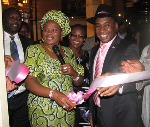 Anabel-opening2 Hon Minster for information and Communications Prof Dora Akunyli cutting the ribbon for the Anabel ultra modern Experience center in Abuja, while the President, Anabel group, Nicholas Okoye holds the ribbon
