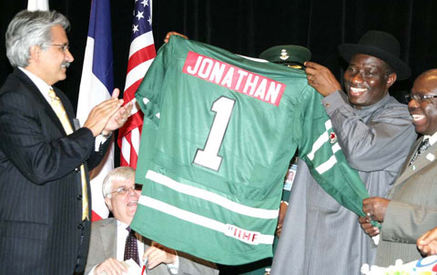 President Goodluck Jonathan (right) with Mr. Ali Moshiri, President, Chevron Africa and Latin America, displaying a jersey presented to him at the G20 Business Leaders Forum, tagged, ''Partnering With Africa's Dynamic Markets Today,'' in Toronto, Canada. yesterday. Photo:State House.