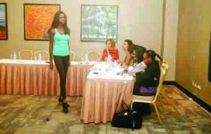 fashion flair- a contestant being drilled by te judges