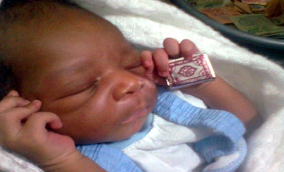 baby clutching quran born in lagos church vanguard news nigeria