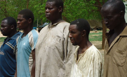 Five of seven suspected terrorists arrested by JTF in connection with Last Sunday's attack on Eyn Church in Biu, paraded in Maiduguri, Borno on Thursday (21/6/12). NAN Photo