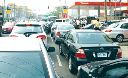 File photo: Long queue at a petrol filling station