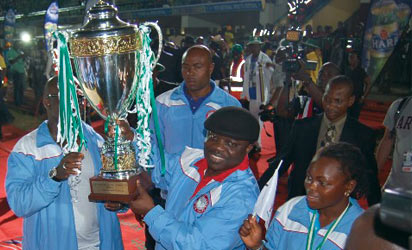 Governor Uduaghan of Delta State (middle) Team Delta Team Captain, Miss. Ruth Izenegwu (eight) and Mr. Amaju Pinnic, Chairman, Delta State Sports Commission (left) Photo: Henry Unini