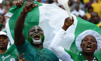Nigerian fans cheer their team during the 2013 African Cup of Nations semi-final football match Mali vs Nigeria on February 6, 2013 in Durban.  Nigeria won 4-1.    AFP PHOTO 
