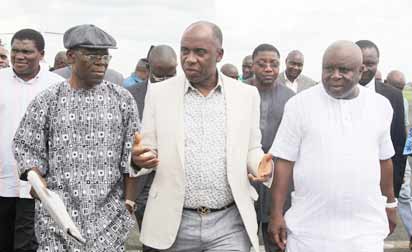 Rivers State Governor Rt. Hon. Chibuike Rotimi Amaechi(m); flanked by House of Representatives member, Chief Andrew Uchendu(left), Elder Chidi Wihioka and supporters on arrival in Port Harcourt Friday