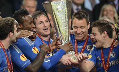 Chelsea's players celebrate with their trophy at the end of the UEFA Europa League final football match between Benfica and Chelsea on May 15, 2013 at Amsterdam Arena in Amsterdam. Chelsea won 2-1. AFP .