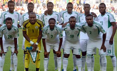 Nigeria's footballers pose for the official picture before the start of the FIFA Confederations Cup Brazil 2013 Group B football match against Tahiti, at the Mineirao Stadium in Belo Horizonte on June 17, 2013. (Standing L-R) Midfielder John Obi Mikel, defender Uwa Echijile, defender Efe Ambrose, defender Kenneth Omeruo, forward Anthony Ujah and midfielder Fegor Ogude. (First row, L-R) Forward Nnamdi Oduamadi, goalkeeper Vincent Enyeama, forward Ahmed Musa, midfielder Sunday Mba and defender Godfrey Oboabona.   AFP PHOTO 