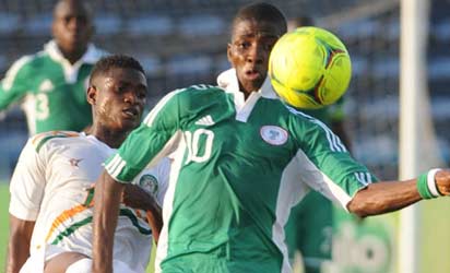 GOLDEN EAGLETS' Kelechi Ihenacho protects the ball from an opponent during a FIFA U-17 World Cup qualifier in Calabar