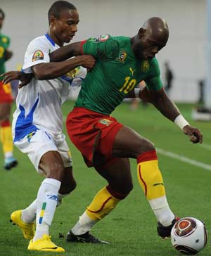 TUSSLE: Arsene Copa of Gabon and Achille Emana of Cameroon in a contest for the ball 