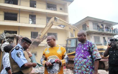 Gov Obi supervising the demolition...