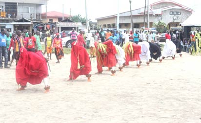 celebration time: Masquerades entertaining the crowd. Photos: Akpokona Omafuaire.