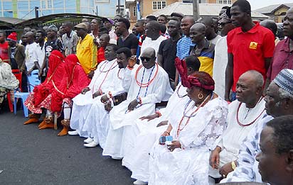 A cross section of chiefs barricading the entrance to Olu of Warri's palace.