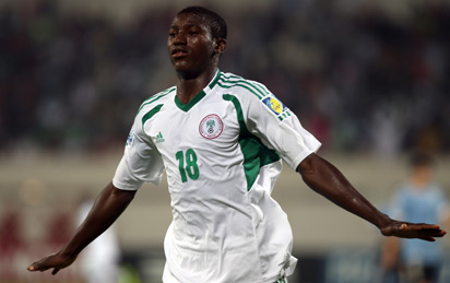 Taiwo Awonity of Nigeria celebrates after scoring against Uruguay during his FIFA U-17 World Cup UAE 2013 football match in Sharjah on November 2, 2013. AFP PHOTO / STR