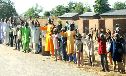 People waving at Gov.Isa Yuguda of Bauch State during official launch of 83km Alkaleri-Futuk road in Alkaleri Lga of Bauchi State recently.