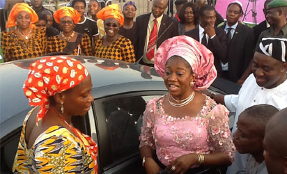 L-R: Mrs. Mwuese Tyokaa, winner of the grand prize at the 'Celebrate the Benue Woman' cooking competition, receiving the keys and particulars of a brand new car from Arc. Mrs. Yemisi Suswam, centre, while Gov Gabriel Suswam, (right) watches  