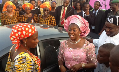 L-R: Mrs. Mwuese Tyokaa, winner of the grand prize at the 'Celebrate the Benue Woman' cooking competition, receiving the keys and particulars of a brand new car from Arc. Mrs. Yemisi Suswam, centre, while Gov Gabriel Suswam, (right) watches