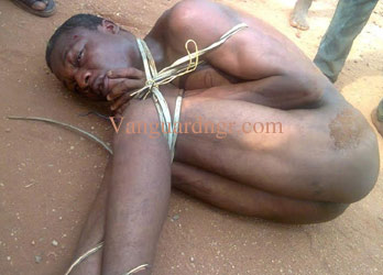 The accused David who beheaded Mrs. Funmilayo Temehin a rtd Senior Magistrate with cutlass at Laderin Housing Estate Abeokuta Friday being over powered PHOTO BY WUMI AKINOLA