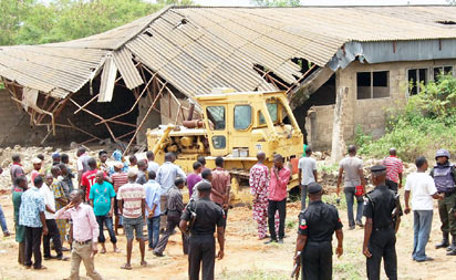 Demolition of the kidnappers' den at Soka forest, Lagos-Ibadan Expressway, as ordered by Oyo State government, began yesterday. PHOTOS: Dare Fasube.