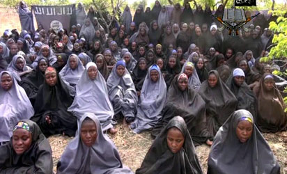 A screengrab taken on May 12, 2014, from a video of Nigerian Islamist extremist group Boko Haram obtained by AFP shows girls, wearing the full-length hijab and praying in an undisclosed rural location. Boko Haram released a new video on claiming to show the missing Nigerian schoolgirls, alleging they had converted to Islam and would not be released until all militant prisoners were freed. A total of 276 girls were abducted on April 14 from the northeastern town of Chibok, in Borno state, which has a sizeable Christian community. Some 223 are still missing. 