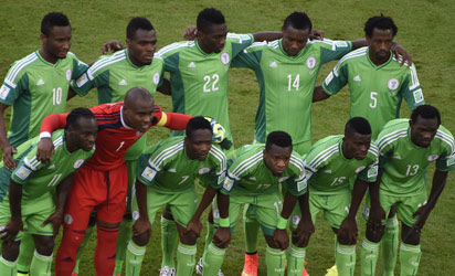 BRAZIL, Curitiba : (From top L) Nigeria's team midfielder John Obi Mikel, forward Emmanuel Emenike, defender Kenneth Omeruo, defender Godfrey Oboabona and defender Efe Ambrose (from bottom L) forward Victor Moses, goalkeeper and captain Vincent Enyeama, forward Ahmed Musa, midfielder Ogenyi Onazi, midfielder Ramon Azeez and defender Juwon Oshaniwa pose during a Group F football match between Iran and Nigeria at the Baixada Arena in Curitiba at the 2014 FIFA World Cup on June 16, 2014. AFP PHOTO