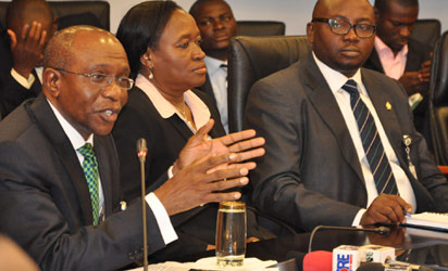 New CBN Governor— From left, new CBN Governor, Mr Godwin Emefiele, his deputies, Sarah Alade and Adebayo Adelabu during a World Press Conference in Abuja, yesterday. Photo: Gbemiga Olamikan. See story on Page 8 