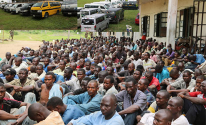 Cross section of Suspected Boko-haram Insurgence arrested between Aro-Ngwa and Imo gate along Enugu-Portharcort Express way in Abia state by the Nigerian Army attached to the state, insert are their (33) buses.